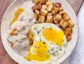 An Egg With Turkey Sausage Gravy Biscuits on First Watch Menus