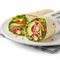 Power Wrap with egg whites, turkey, spinach, and mozzarella in a whole wheat wrap, served with fresh fruit.