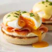 First Watch Smoked Salmon Benedict with poached eggs, smoked salmon, hollandaise sauce, and toasted ciabatta.